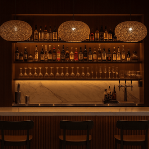 Bar setup with shelves of bottles and glasses, dimly lit ambiance