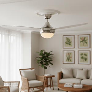 Satin chrome ceiling fan with integrated light in a modern living room setting, featuring a cozy seating area and