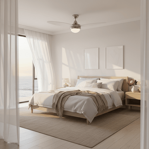Satin chrome ceiling fan in a bright bedroom with a large window and ocean view.