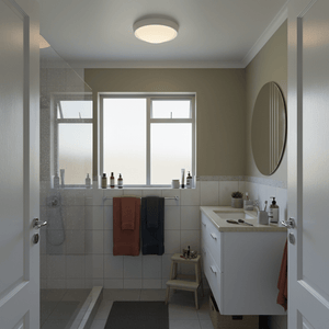 Bright Star white ceiling light installed in a modern bathroom with towels and toiletries visible.