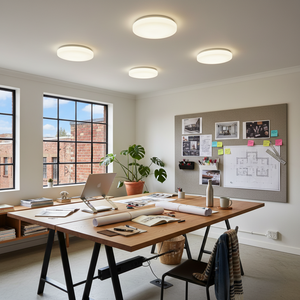 Modern office space with a large wooden desk, chairs, and decorative elements.