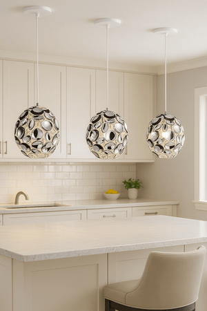 Three modern pendant lights hanging above a kitchen island.