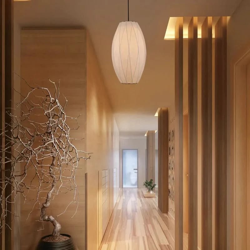 Silk Pearl Pendant Light hanging in a modern hallway with wooden walls and decor.
