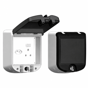 Two views of a waterproof socket outlet box with a smokey black flap, one open and one closed.