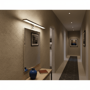Polished aluminium mirror light above a sleek mirror in a modern hallway setting.