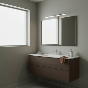 Polished aluminium mirror light above a modern bathroom vanity with a sleek design.