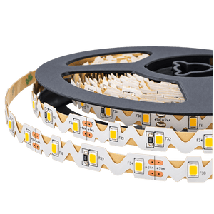 Close-up of a black reel holding a flexible S-shaped LED striplight with white and yellow light-emitting diodes.