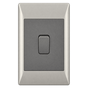 A rectangular switch with a dark gray lever on a silver frame, featuring a smooth finish.