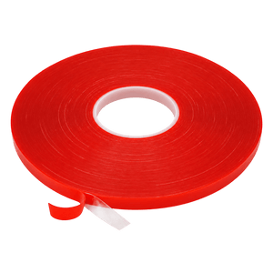 A roll of high-bond double-sided tape in bright red, with a white core and a small portion of tape unspooled.