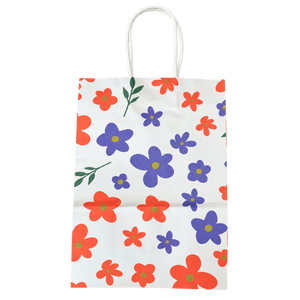 White gift bag with orange and purple floral pattern and green leaf accents