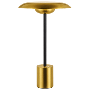 Gold table lamp with black stem and cylindrical base, dome shade, on green background