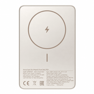 Gold Xiaomi Super Slim Magnetic Power Bank 5000 with a circular charging symbol and text on a smooth surface.