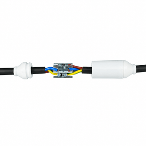 Resin filled cable join kit featuring a white finish, black cables, and visible colored wires within a metal connector.