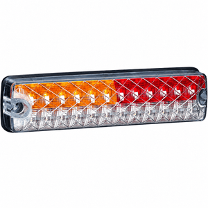 LED truck/trailer tail light with a slim design, featuring red, amber, and clear lenses in a black housing.