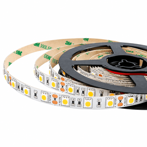 A coiled LED strip light with a black reel, featuring white and yellow light-emitting diodes.