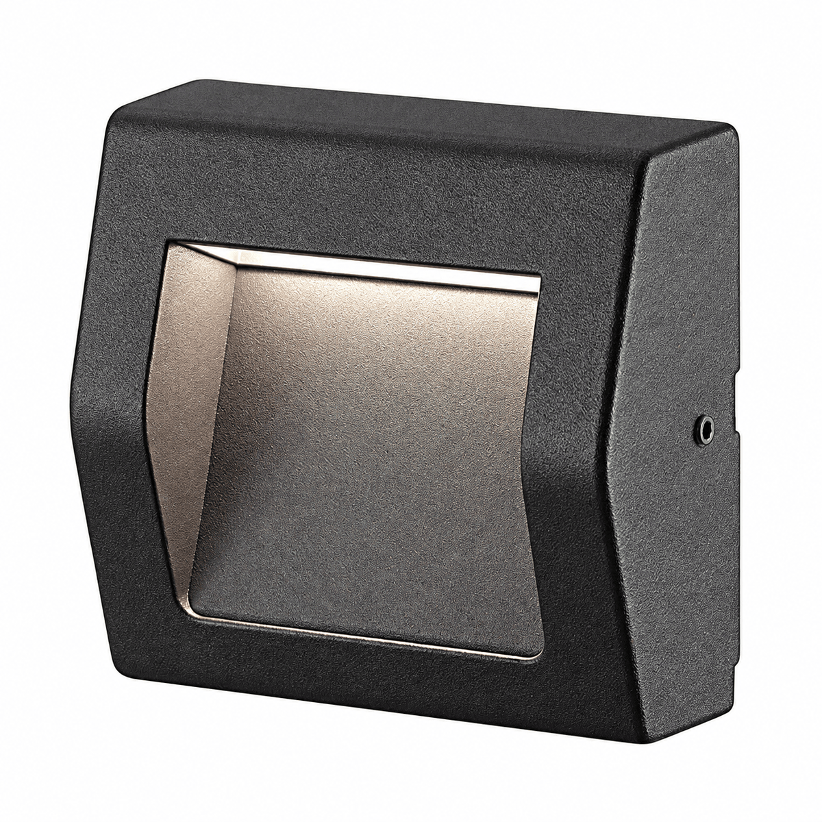 Black surface-mounted LED foot light with a rectangular design and a textured finish, featuring a warm light source.