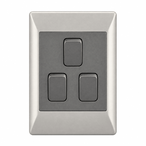 A rectangular, metallic switch plate with three dark buttons, two rectangular and one square, on a light background.