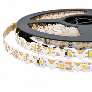 Close-up of a black reel holding a red LED striplight, featuring a zigzag pattern and visible light-emitting diodes.