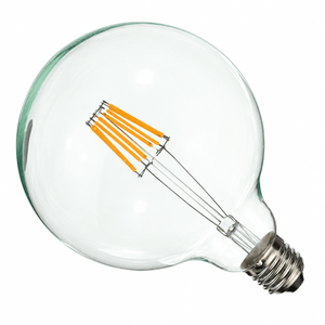 Clear opalina filament LED bulb with a silver B22 base and orange filament, set against a white background.