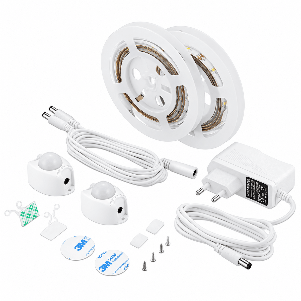 Two reels of LED strip lights, white motion sensors, cables, a power adapter, and mounting accessories on a white background.