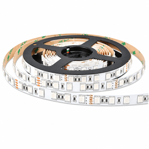 A coiled RGB LED striplight on a black reel, featuring white and orange circuit markings, with a waterproof finish.