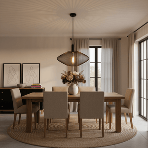 Stylish black mesh ceiling light above a wooden dining table with floral centerpiece and modern decor.