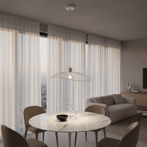 Stylish Sensu Solo White Pendant Light hanging above a marble dining table with modern chairs.