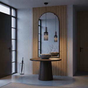 Stylish entrance hall featuring the pendant light above a round table with decorative bowls.