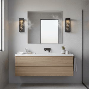 Baton LED Wall Light mounted beside a bathroom mirror, illuminating the space with a warm glow.