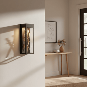 Baton LED Wall Light mounted on a wall, casting warm light and shadows, with a decorative table and door in the background.
