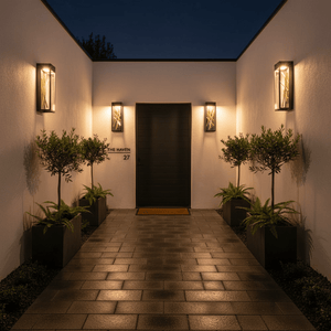 Outdoor scene featuring two Baton LED Wall Lights flanking a modern entrance, illuminating a pathway with warm light.