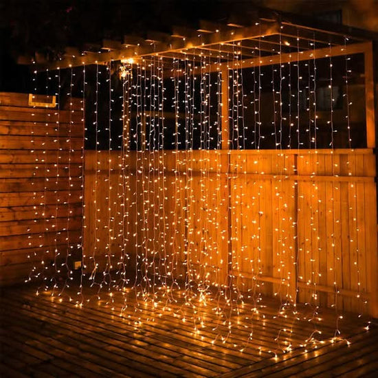 LED curtain lights cascading down a wall or window