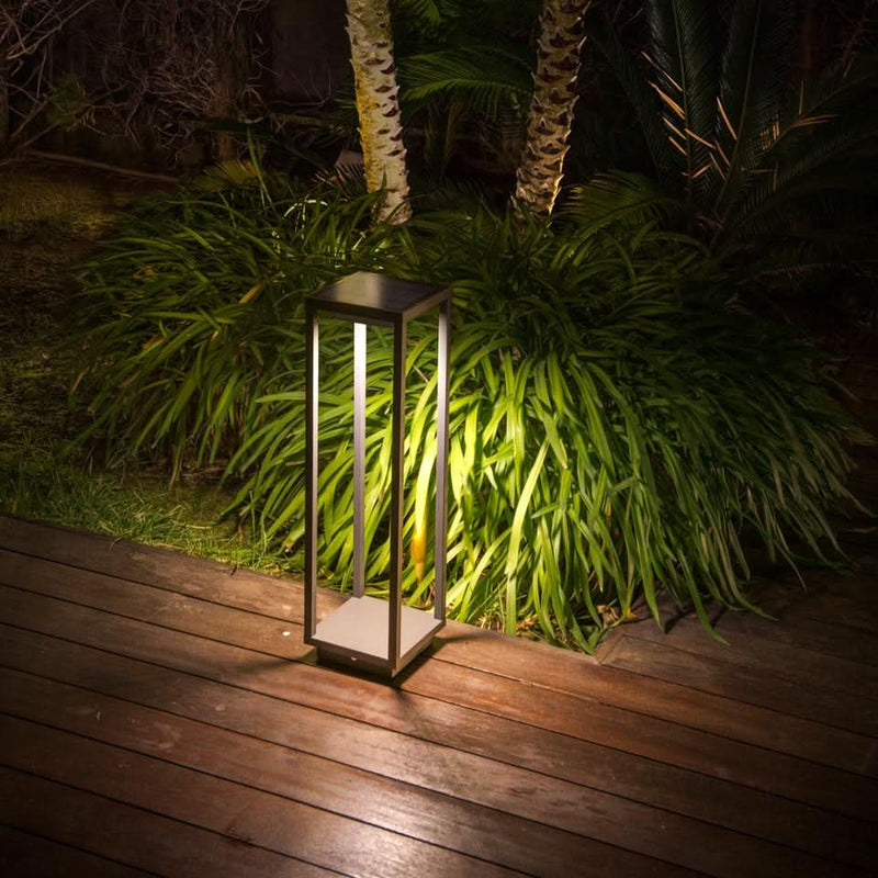 Solar-powered garden bollard lights in a landscaped South African setting