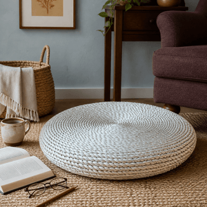 Round woven natural floor cushion in a lived-in South African interior, lifestyle scene 3