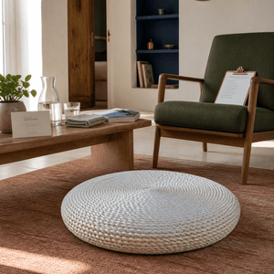 Round woven natural floor cushion in a lived-in South African interior, lifestyle scene 4