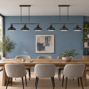 Pair of Orka black three light pendants over a dining work table