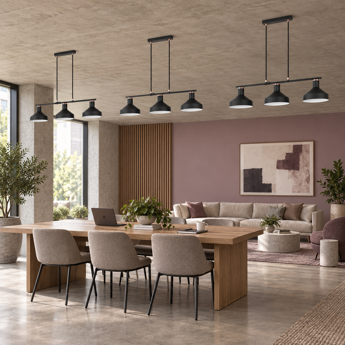 Three Orka black three light pendants in a mauve office lounge