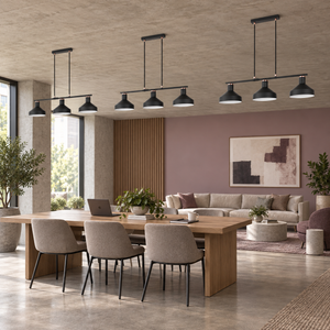 Three Orka black three light pendants in a mauve office lounge