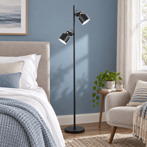 Orka black floor lamp in a dusty blue bedroom corner