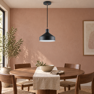 Orka black pendant over a clay pink dining nook