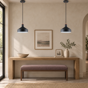 Pair of Orka black pendants in a mauve entryway