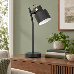 Orka black table lamp on a sage living room sideboard