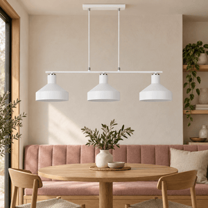 Orka white three light pendant above a clay bench dining area