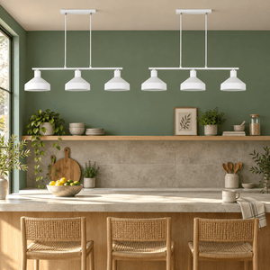 Pair of Orka white three light pendants over a breakfast counter
