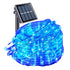 Blue LED string lights with solar panel on a white background