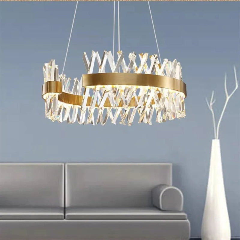 Elegant gold chandelier mounted above dining setting