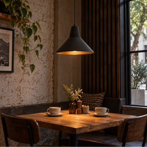 Sentino black cone pendant over a café table
