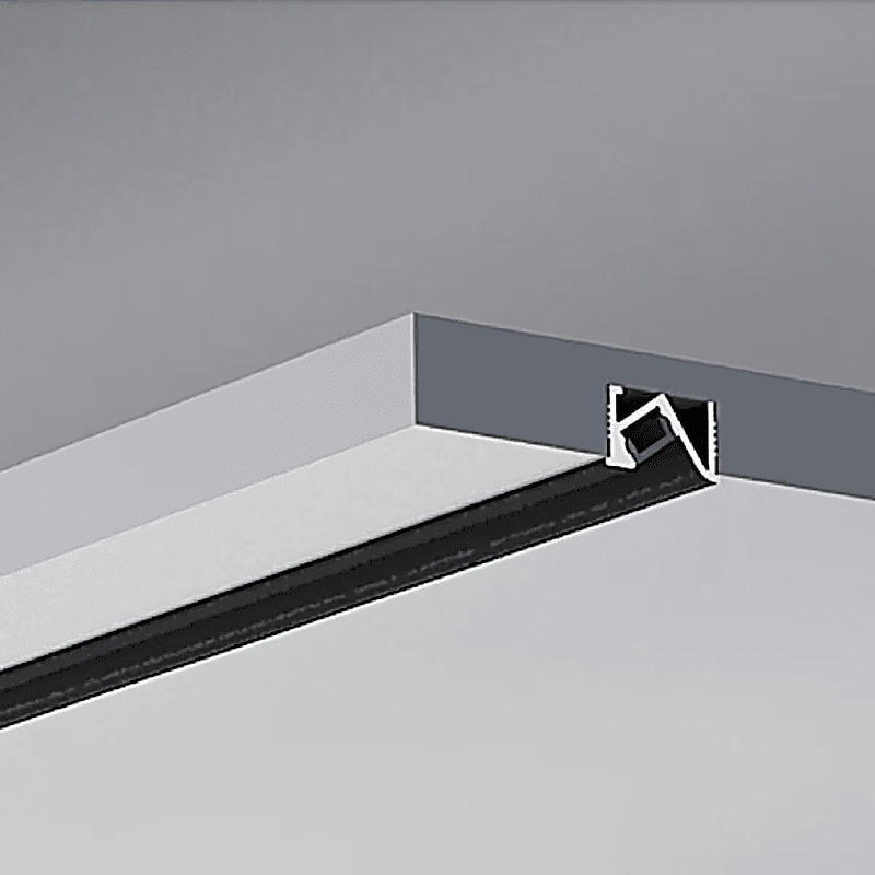 Detail view of recessed cabinetry extrusion installed in a ceiling corner, showcasing its sleek profile and opal diffuser.