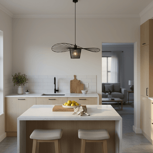 Stylish kitchen featuring the Sensu Infinite Black Pendant Light above a marble island with lemons and a wooden cutting