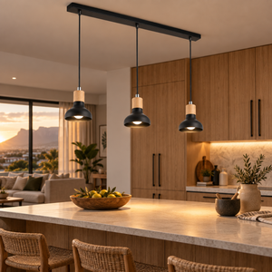 Three-light black pendant over a timber kitchen island